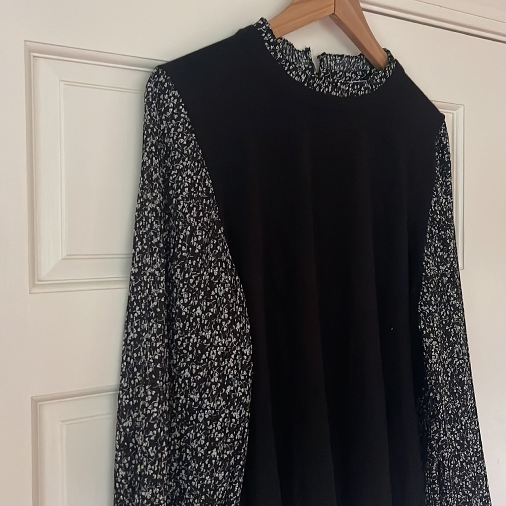 Black sweater top with patterned sleeves